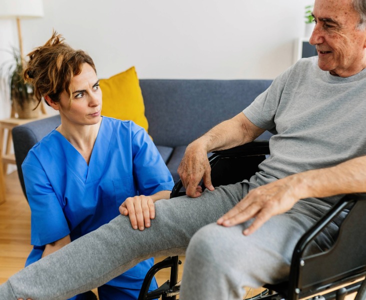 Physiotherapist helping older patient