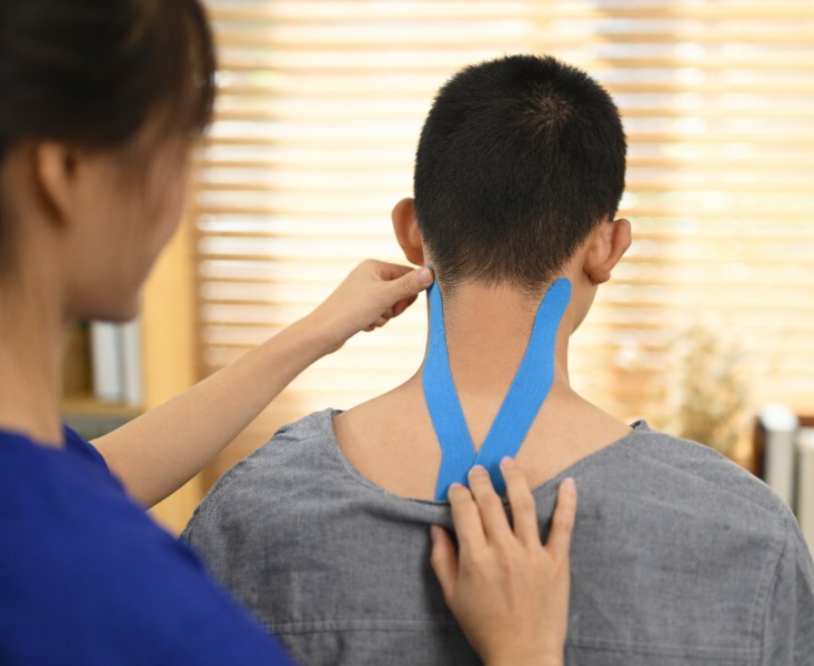 Rehab specialist taping for support